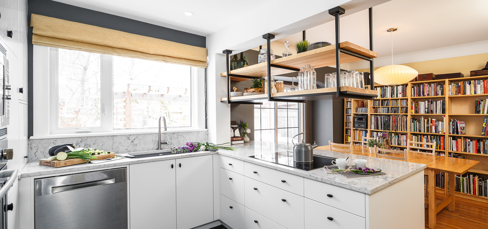 Small industrial kitchen in Ottawa with flat-panel cabinets, white cabinets, granite benchtops, white splashback, stainless steel appliances and with island.