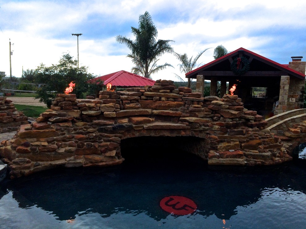 Pool fountain - backyard pool fountain idea in Austin