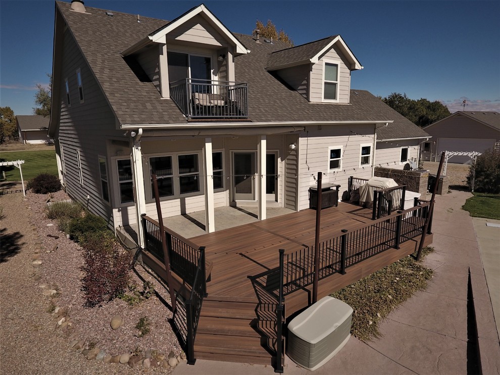 Mid-sized transitional backyard deck photo in Denver with no cover