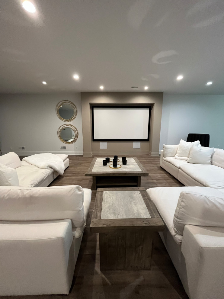 Inspiration for a large contemporary open concept home theatre in Detroit with brown walls, vinyl floors, a projector screen and brown floor.