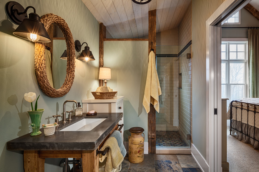 Design ideas for a mid-sized country master bathroom in Other with an alcove shower, green walls, slate floors, concrete benchtops, open cabinets, dark wood cabinets, a two-piece toilet, beige tile, porcelain tile, an undermount sink, multi-coloured floor and a hinged shower door.