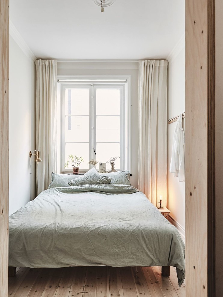 This is an example of a small scandinavian bedroom in Malmo.