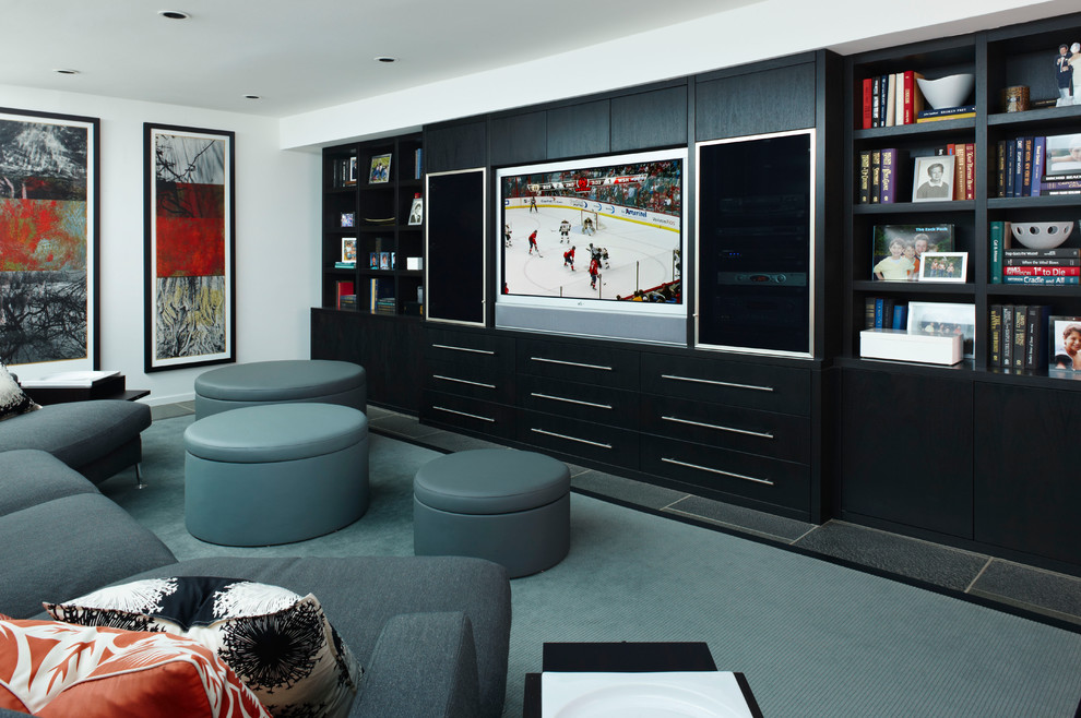 Photo of a contemporary home theatre in Detroit with a built-in media wall.