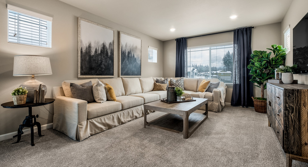 Design ideas for a mid-sized traditional open concept family room in Seattle with a game room, beige walls, carpet, no fireplace, a wall-mounted tv and beige floor.