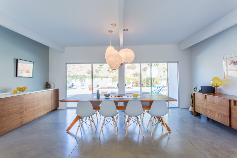 This is an example of a midcentury dining room in San Diego.