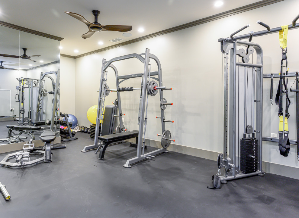 Inspiration for a mid-sized modern multipurpose gym in Other with grey walls and grey floor.