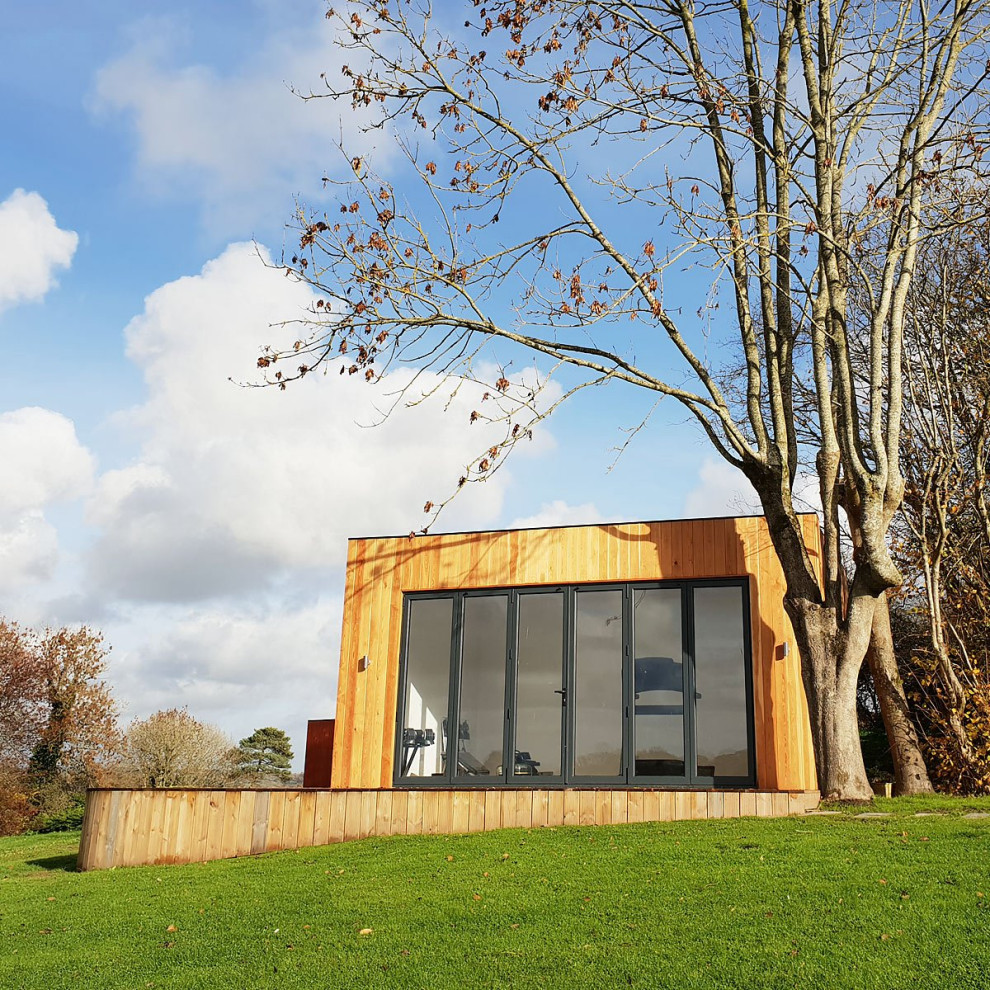 Example of a mid-sized minimalist detached studio / workshop shed design in Sussex