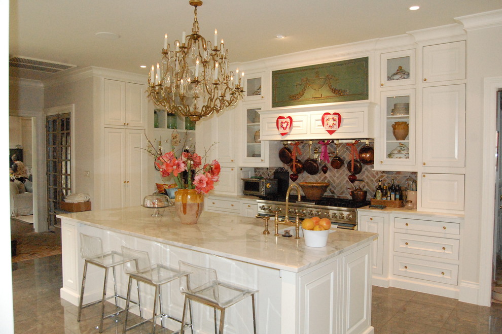 Inspiration for a large traditional l-shaped kitchen in Houston with ceramic floors, a triple-bowl sink, beaded inset cabinets, white cabinets, quartzite benchtops, red splashback, brick splashback, stainless steel appliances and with island.