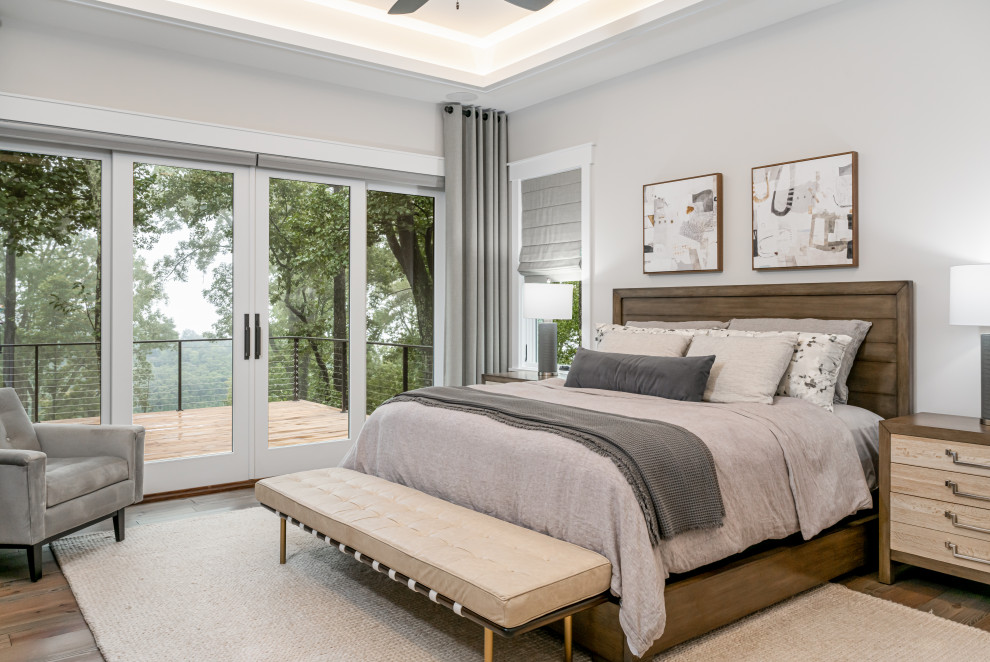 Transitional master bedroom in Other with grey walls, medium hardwood floors, brown floor and recessed.