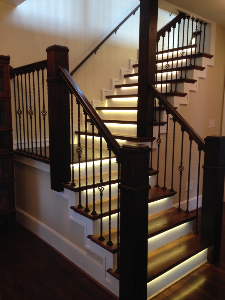 Mid-sized cottage painted l-shaped staircase photo in Louisville with wooden risers