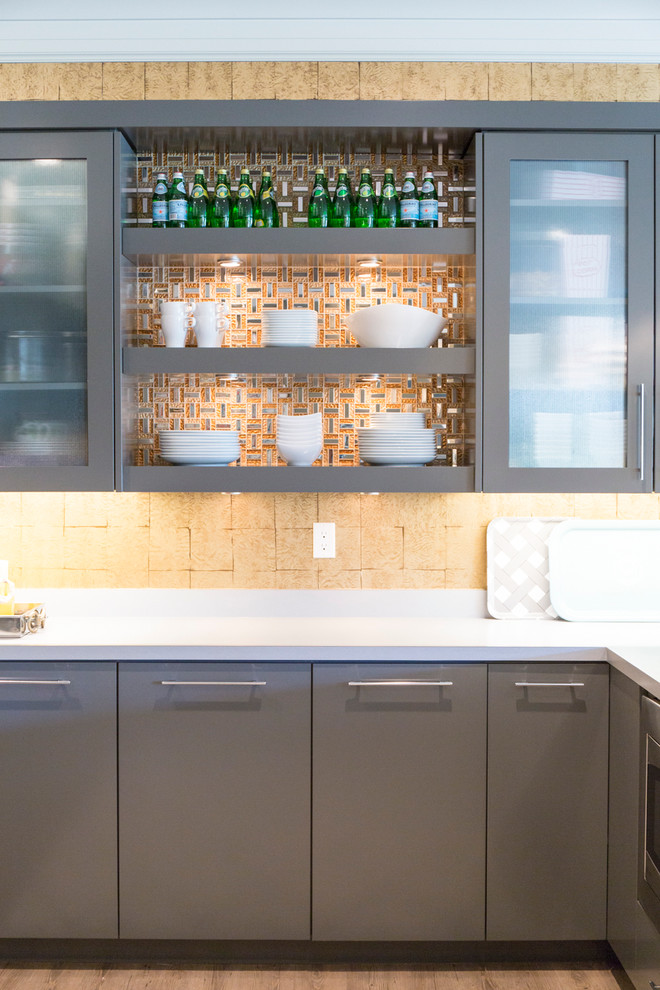 Large scandinavian u-shaped kitchen pantry in Salt Lake City with flat-panel cabinets, grey cabinets, with island, quartz benchtops, beige splashback, stone tile splashback and light hardwood floors.