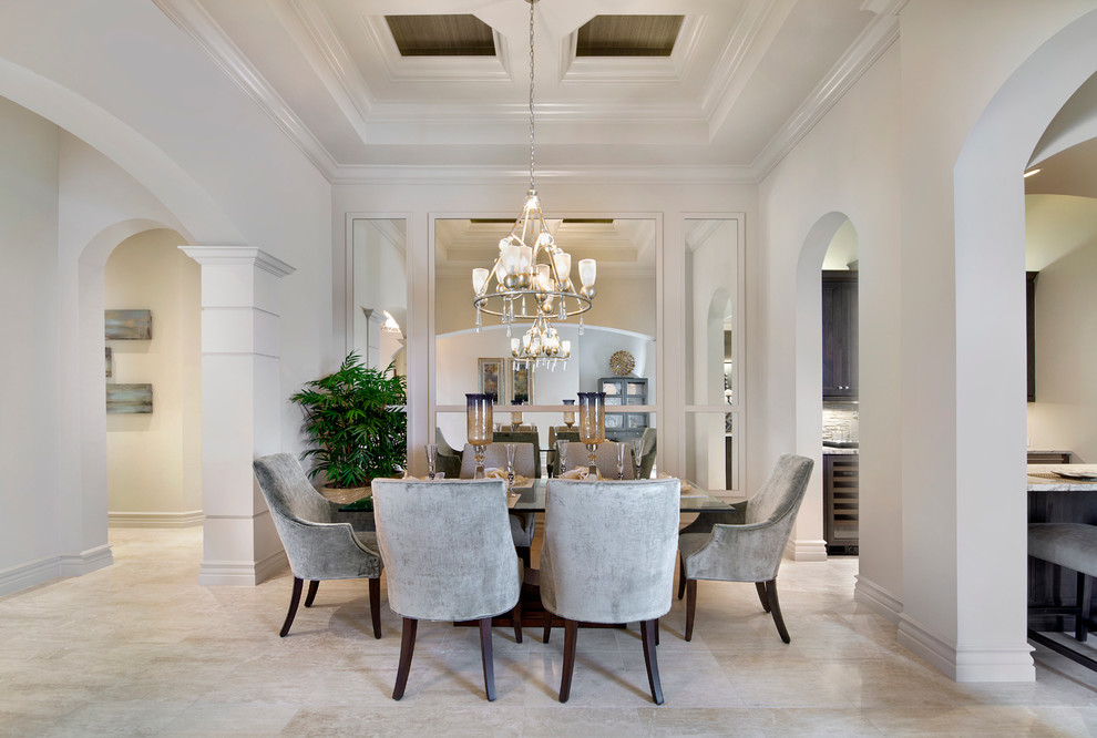 This is an example of a transitional dining room in Miami with white walls and no fireplace.