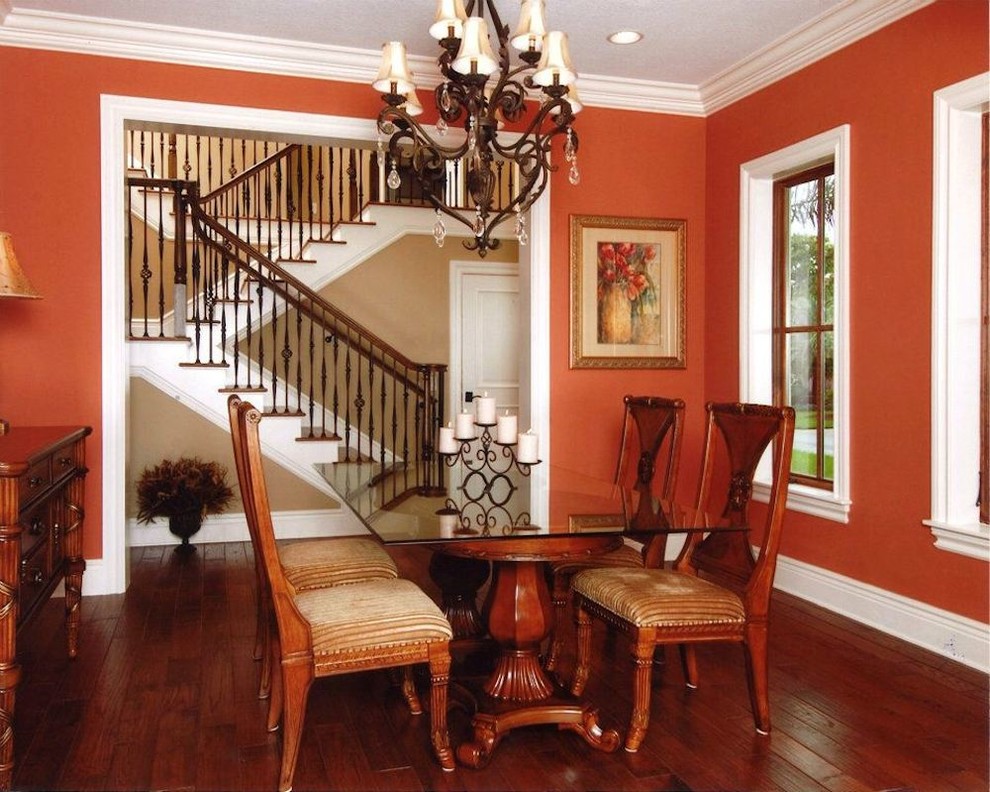 This is an example of a transitional dining room in Tampa.