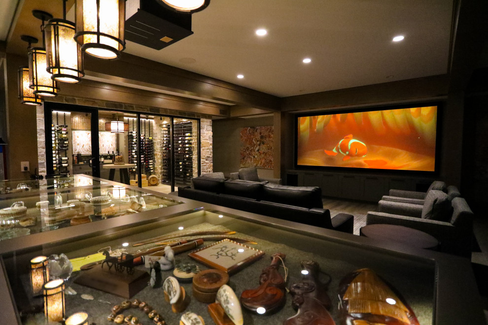 Home theater - large traditional open concept porcelain tile home theater idea in Other with a projector screen
