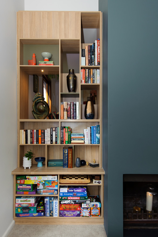 Inspiration for a mid-sized contemporary open concept living room in Sydney with a music area, grey walls, carpet, a standard fireplace, a concrete fireplace surround, a built-in media wall and beige floor.