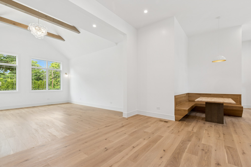 Custom Oak Breakfast Nook with Integrated Banquette and Vaulted Living View