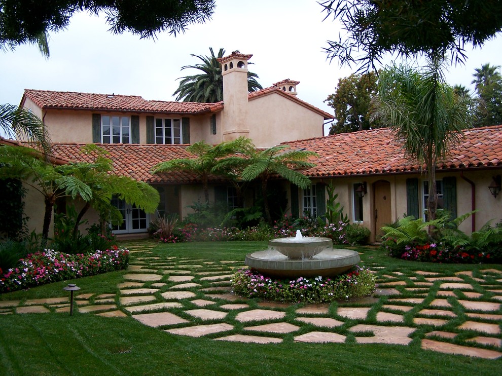Design ideas for a large mediterranean courtyard partial sun garden in Santa Barbara with a water feature and natural stone pavers.