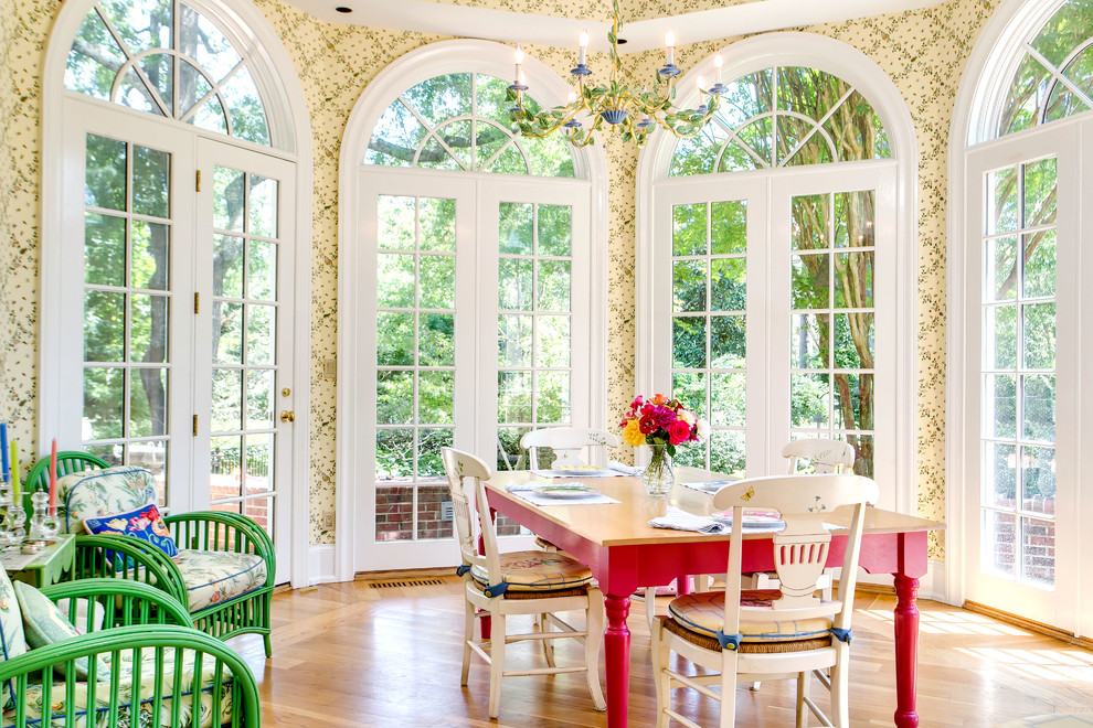 Inspiration for a traditional dining room in Raleigh with light hardwood floors and multi-coloured walls.