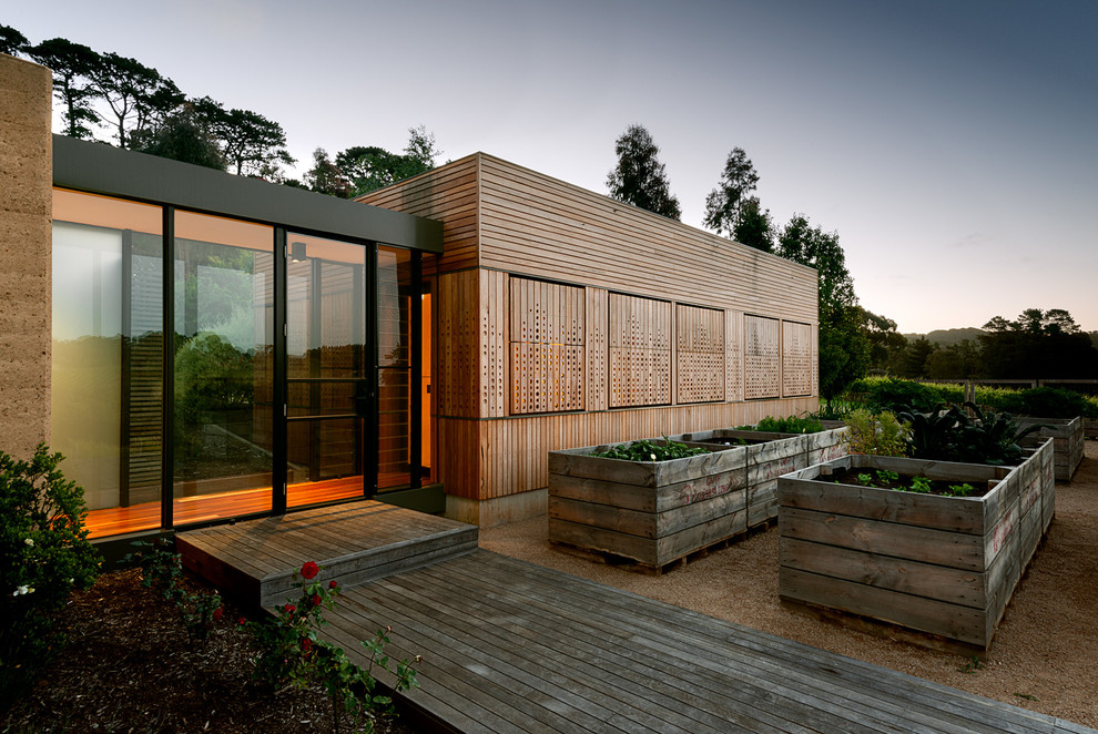 Small contemporary one-storey brown exterior in Melbourne with wood siding.