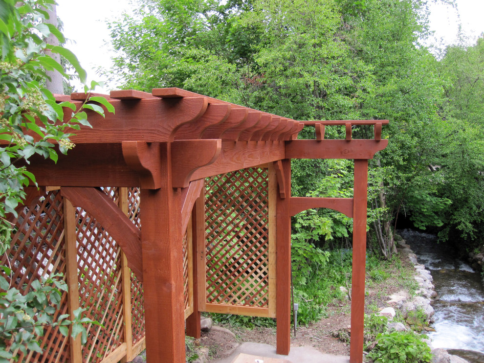 Photo of a small country side yard patio in Salt Lake City with a pergola.