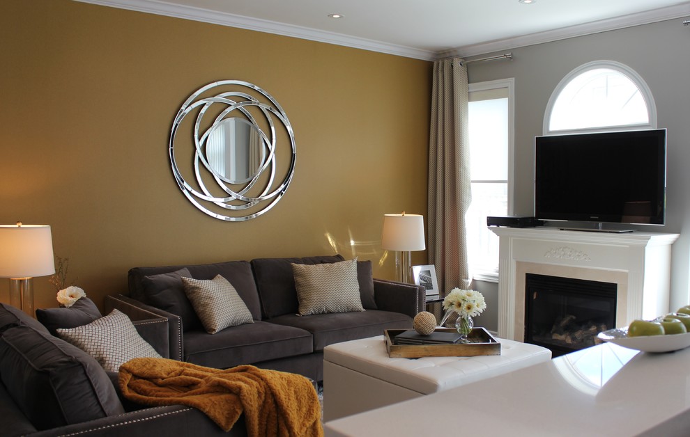 This is an example of a small transitional open concept living room in Toronto with yellow walls.