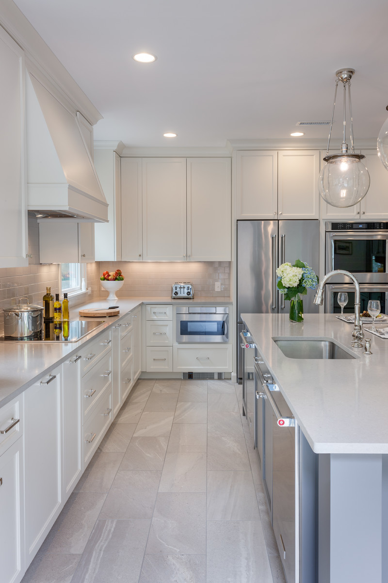 Inspiration for a transitional kitchen in Boston with an undermount sink, grey cabinets, quartzite benchtops, subway tile splashback, stainless steel appliances and with island.