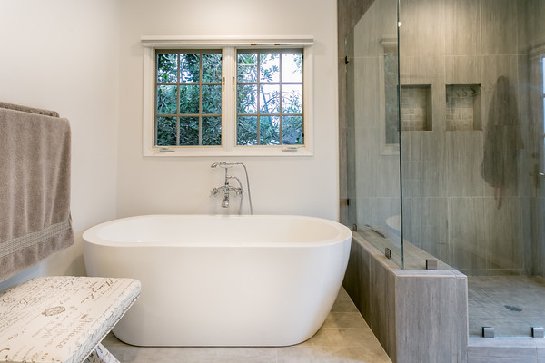 Inspiration for a large modern bathroom in Los Angeles with a freestanding tub, shaker cabinets, white cabinets, a two-piece toilet, white tile, white walls, ceramic floors, an undermount sink and with a sauna.