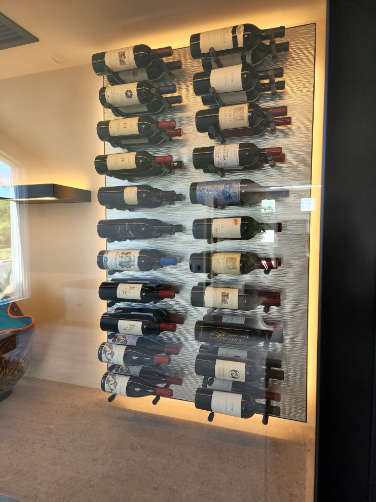 This is an example of a classic wine cellar in Los Angeles with storage racks.