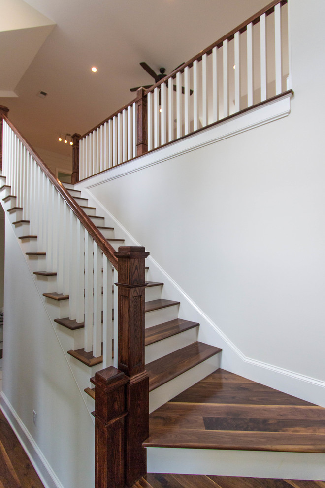 Inspiration for a timeless dark wood floor staircase remodel in Charleston with white walls