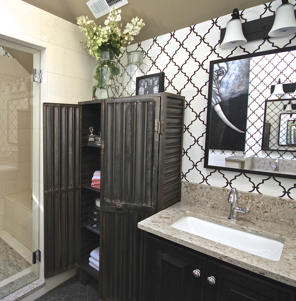 Small eclectic kids bathroom in Seattle with furniture-like cabinets, dark wood cabinets, engineered quartz benchtops, beige tile, stone tile, an open shower, a two-piece toilet, an undermount sink, black walls and limestone floors.