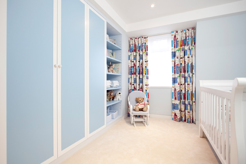 Contemporary kids' room in London with blue walls.