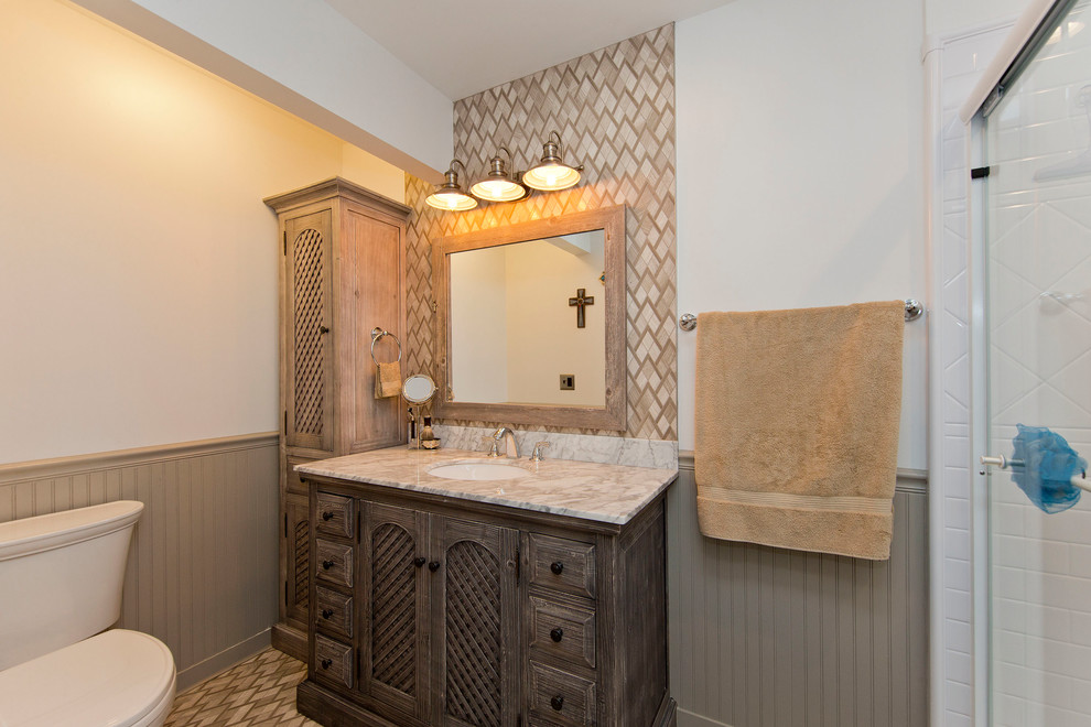 Design ideas for a mid-sized country master bathroom in DC Metro with furniture-like cabinets, distressed cabinets, white tile, subway tile, quartzite benchtops, white benchtops, a two-piece toilet, beige walls, an undermount sink, beige floor, a sliding shower screen and an alcove shower.