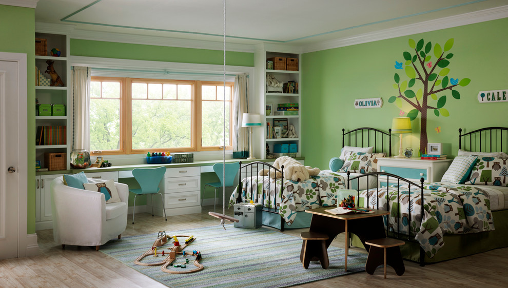 Inspiration for a mid-sized traditional gender-neutral kids' bedroom for kids 4-10 years old in Seattle with green walls and light hardwood floors.