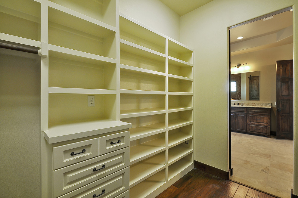 This is an example of a mediterranean storage and wardrobe in Austin.