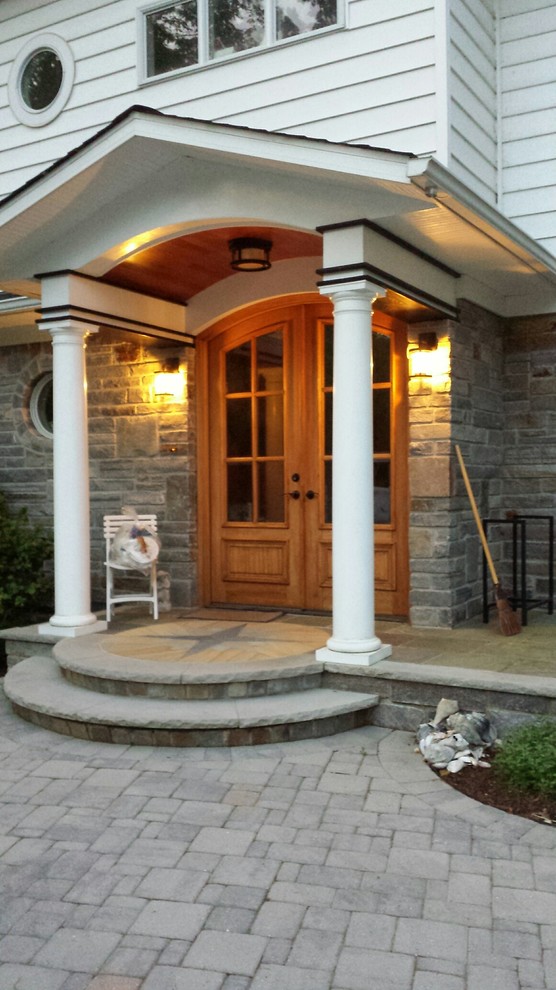 Design ideas for a contemporary front door in Other with a double front door and a light wood front door.
