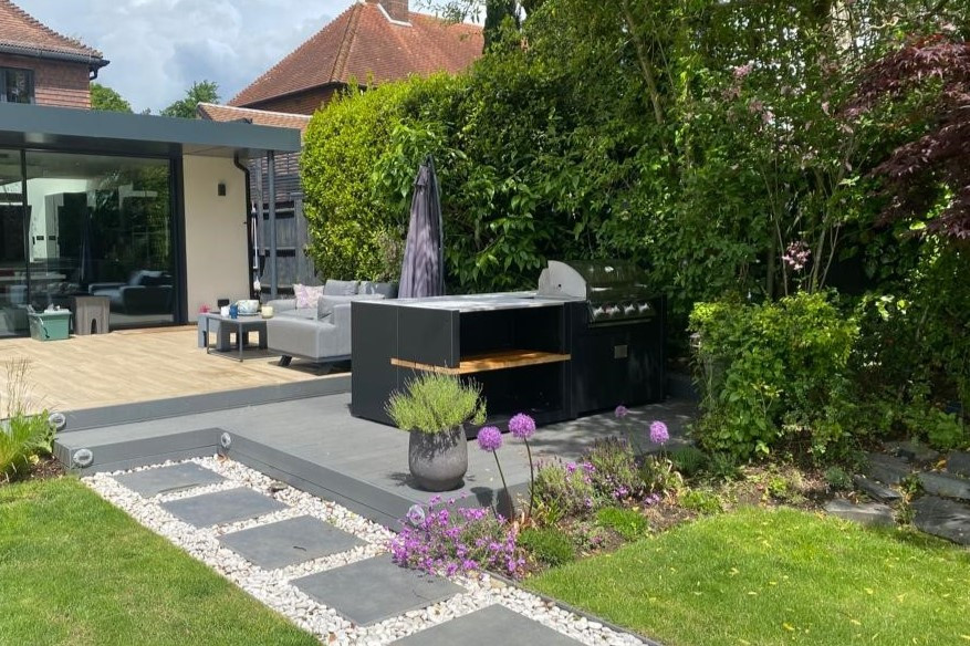 Small contemporary back patio in Kent with an outdoor kitchen, decking and no cover.