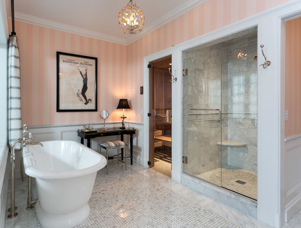 Design ideas for an expansive traditional master bathroom in New York with a freestanding tub, an alcove shower, white tile, pink walls, marble, mosaic tile floors and a hinged shower door.