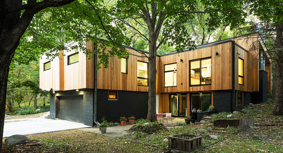 This is an example of a contemporary exterior in Minneapolis with wood siding.