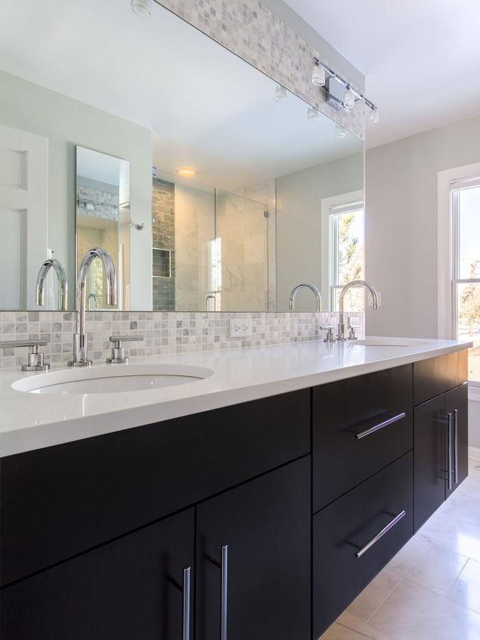 This is an example of a large contemporary master bathroom in Chicago with an undermount sink, flat-panel cabinets, multi-coloured tile, gray tile, white tile, mosaic tile, black cabinets, an alcove shower, grey walls, engineered quartz benchtops, a freestanding tub, a one-piece toilet, marble floors, white floor, a hinged shower door and yellow benchtops.