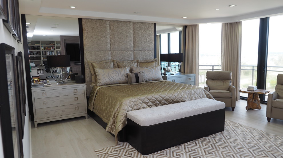 Inspiration for a mid-sized contemporary master bedroom in Miami with beige walls, light hardwood floors and no fireplace.