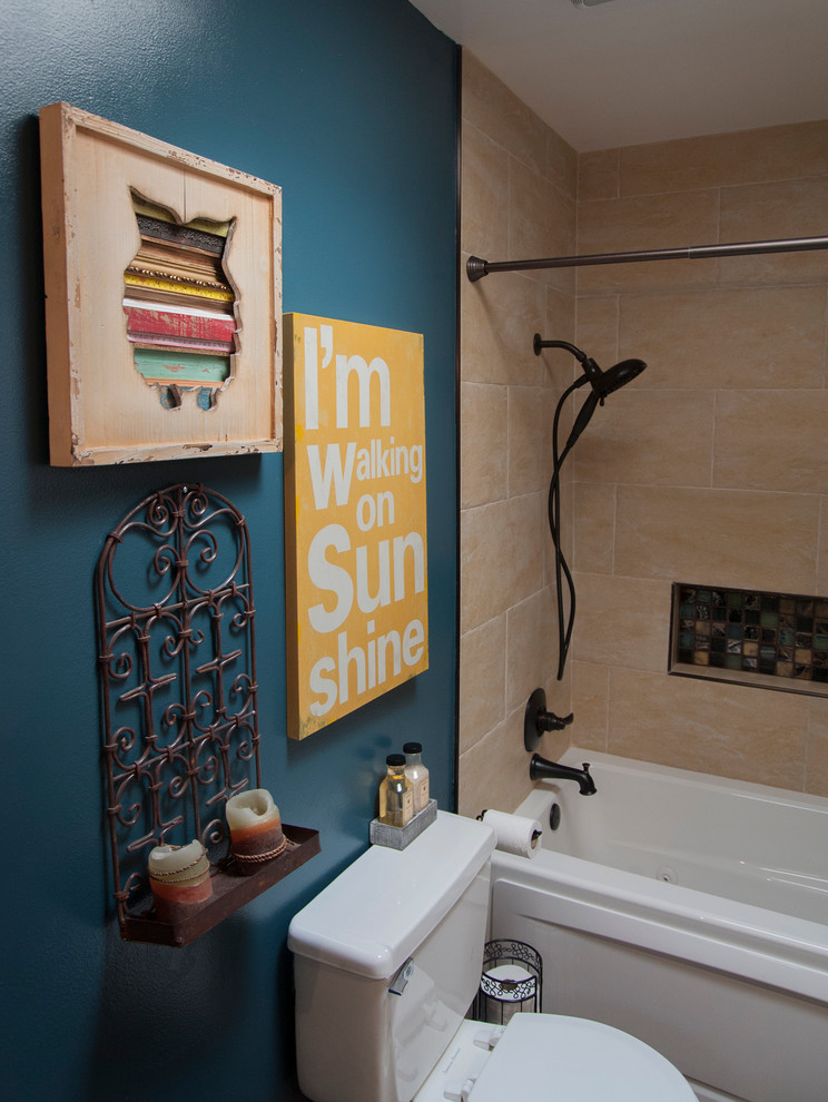 Design ideas for a mid-sized eclectic kids bathroom in San Francisco with furniture-like cabinets, distressed cabinets, an alcove tub, a shower/bathtub combo, a two-piece toilet, beige tile, porcelain tile, blue walls, porcelain floors, a drop-in sink and marble benchtops.
