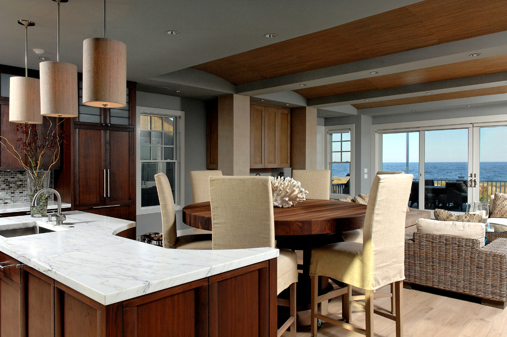 Example of a mid-sized transitional l-shaped light wood floor open concept kitchen design in DC Metro with an undermount sink, medium tone wood cabinets, marble countertops, mosaic tile backsplash, paneled appliances and an island