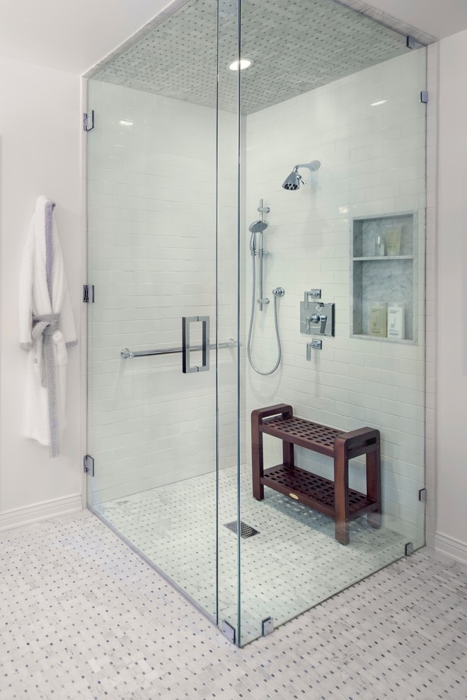 Inspiration for a mid-sized transitional bathroom in Los Angeles with shaker cabinets, white cabinets, a one-piece toilet, gray tile, stone tile, grey walls and mosaic tile floors.