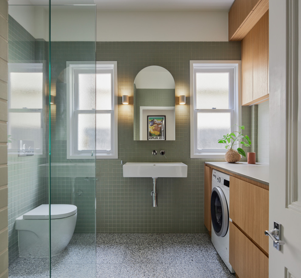 Design ideas for a small contemporary bathroom in Melbourne with terrazzo floors and solid surface benchtops.