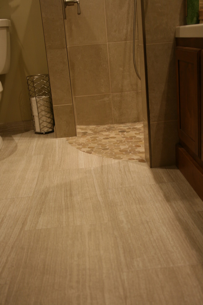 Example of a mid-sized transitional master beige tile and pebble tile porcelain tile walk-in shower design in Chicago