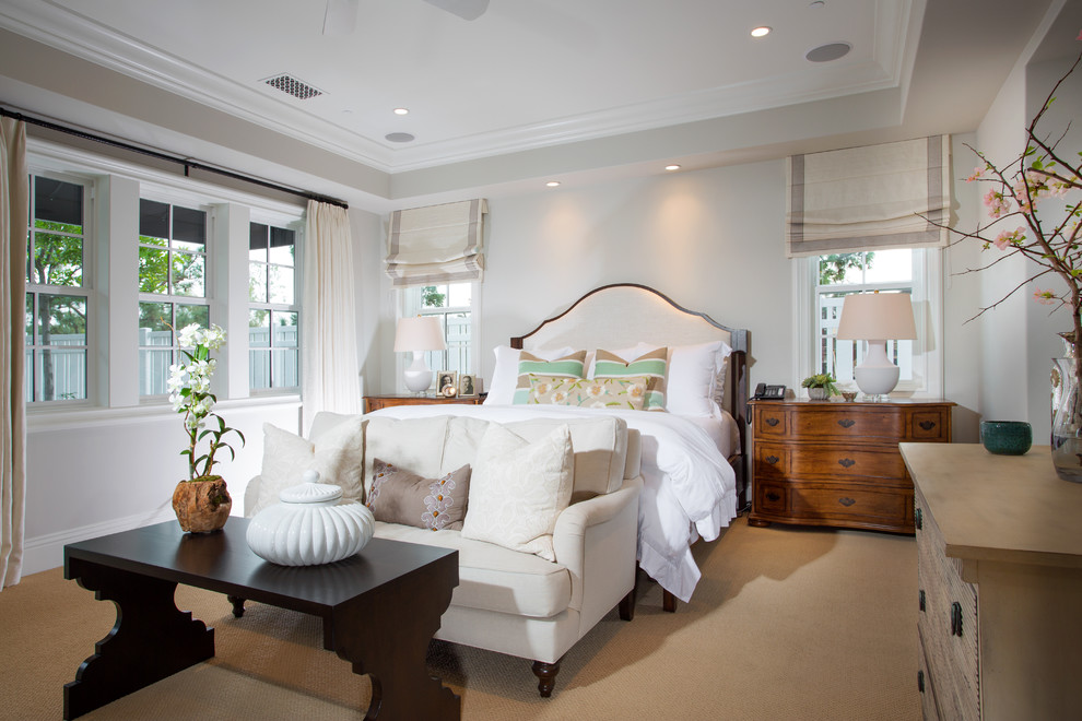 Inspiration for a large traditional master bedroom in Orange County with carpet, grey walls and brown floor.