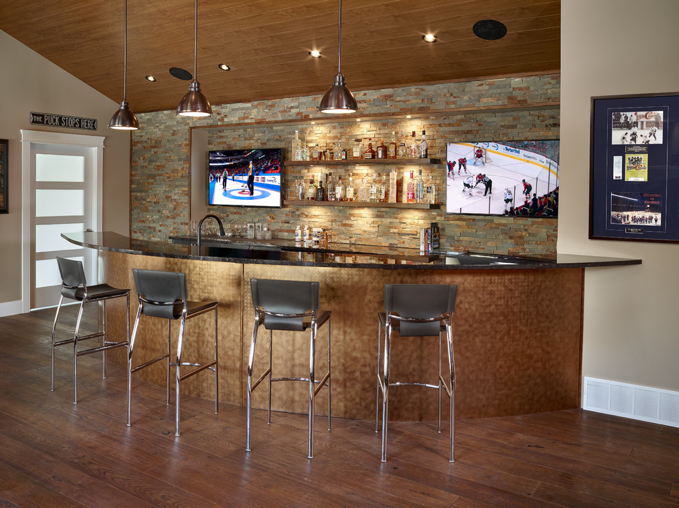Photo of a large contemporary seated home bar in Edmonton with quartz benchtops, open cabinets, multi-coloured splashback, slate splashback, dark hardwood floors and brown floor.