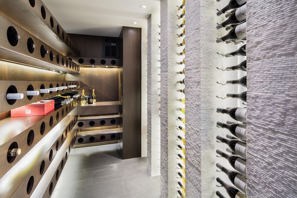Design ideas for a small contemporary wine cellar in Orange County with display racks, grey floor and porcelain floors.
