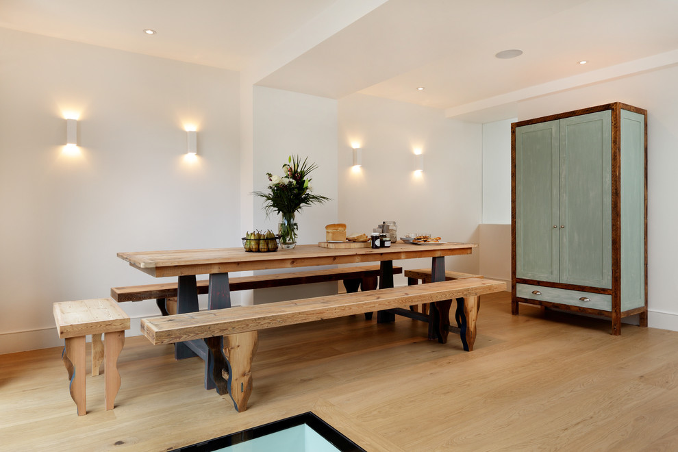 Photo of a transitional dining room in London.