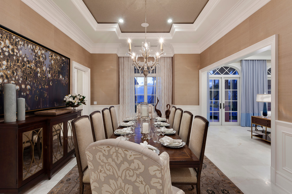 Design ideas for an expansive traditional dining room in Miami with brown walls, porcelain floors, no fireplace and beige floor.